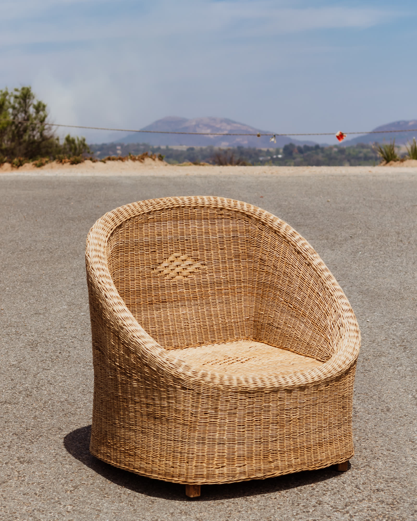 Curved Rattan Single Seat — handwoven rattan by LOWE Design Studio
